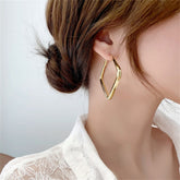 18K gold-plated open square hoop earrings with a modern design, perfect for adding elegance to any outfit.